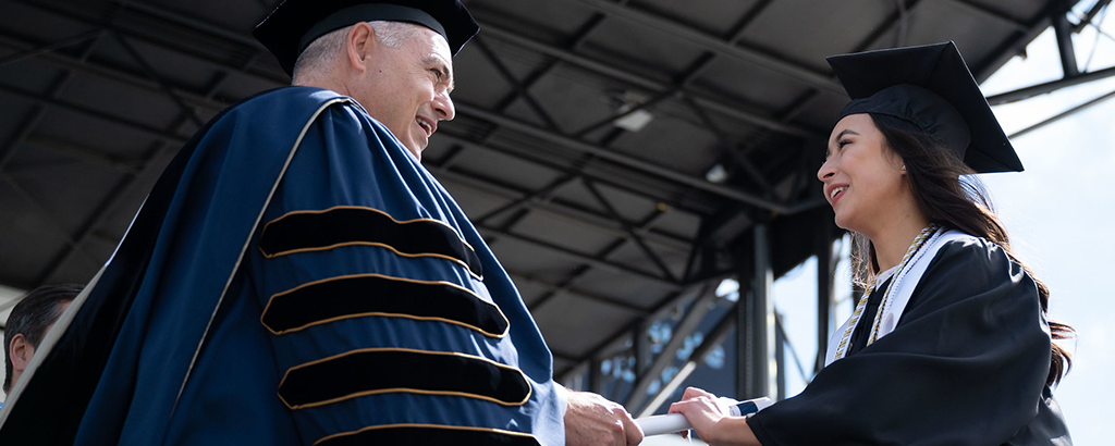 photo of graduate receiving diploma