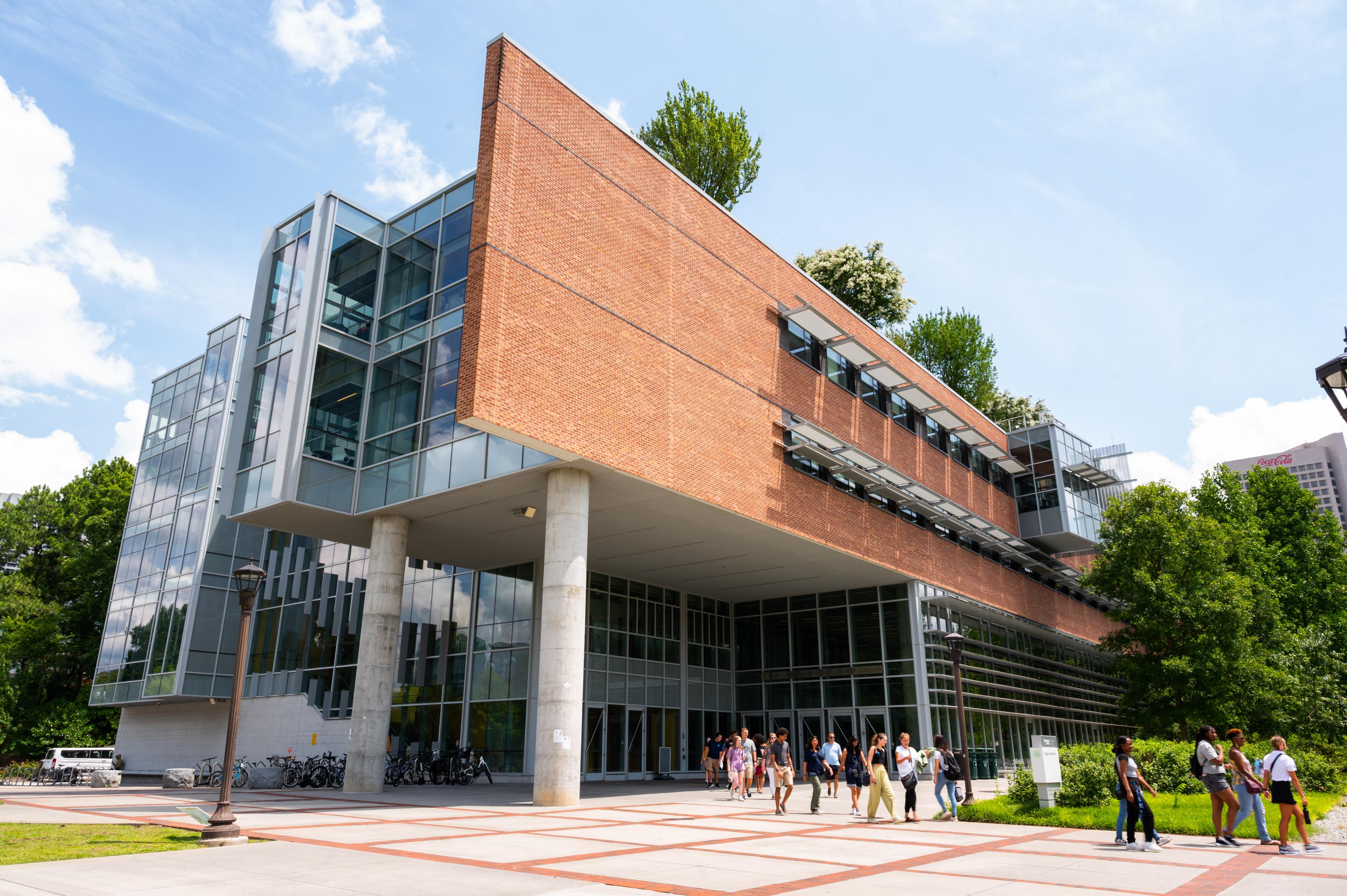 students walking outside of the Clough building