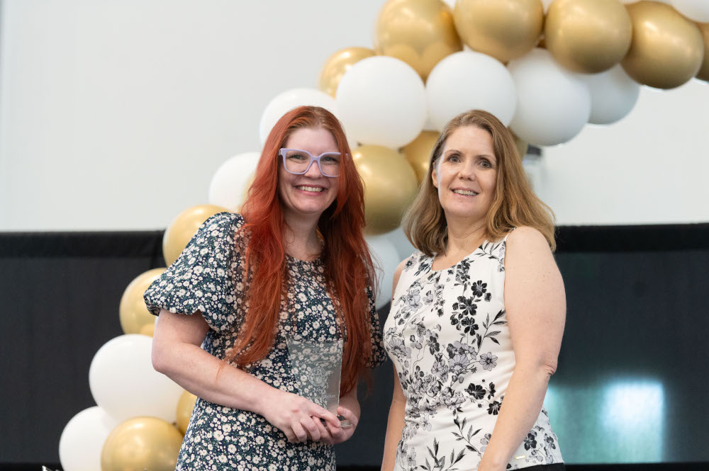 Amanda Blocker poses for award