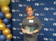 Lynn Isaac receiving an award after completing the Georgia Tech SOAR program.