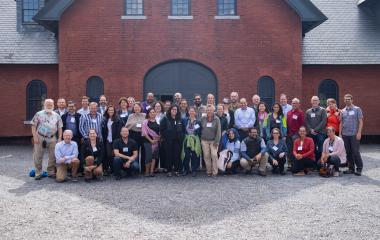 Conference goers pose for group photo