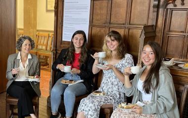 Shannon at Oxford having tea with students