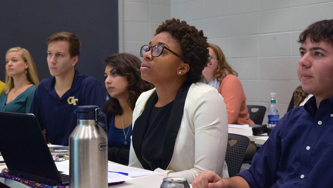 student listens in an SLS course