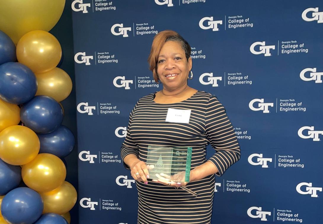 Lynn Isaac receiving an award after completing the Georgia Tech SOAR program.