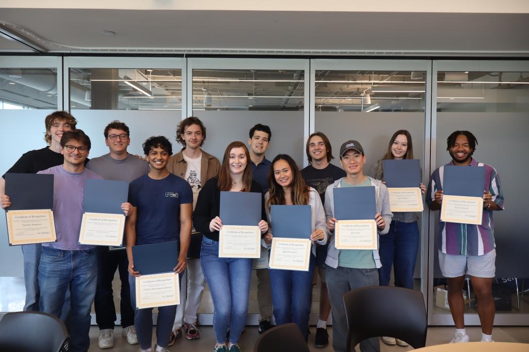 2021 and 2022 FYSA cohort graduates pose for a group picture with their certificates.